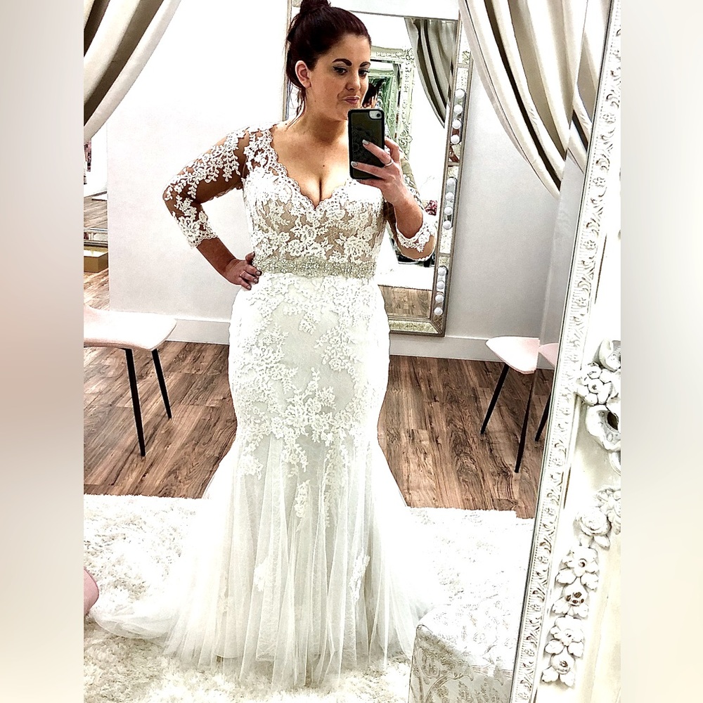Lace wedding dress with sleeves and custom rhinestones belt.